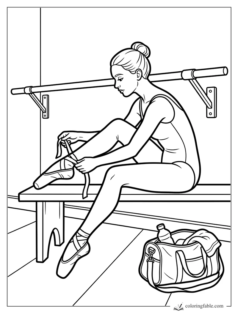 Ballerina tying pointe shoe ribbons on a bench beside a barre and dance bag