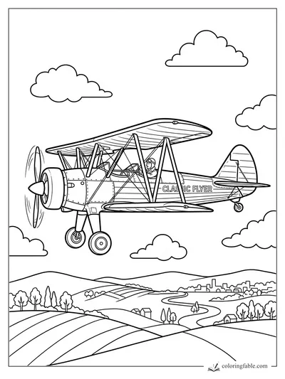 Classic biplane with spinning propeller flying above hills, fields, clouds, and a small town