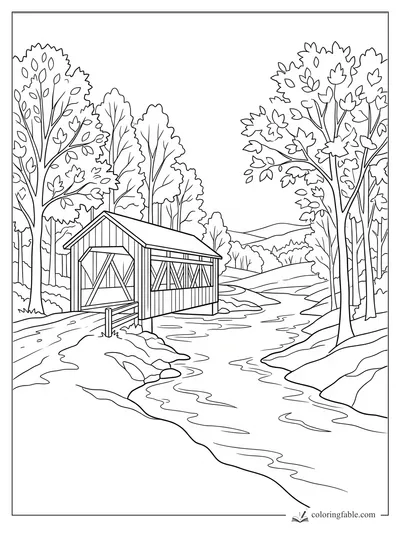 Covered wooden bridge over a winding creek with fall trees and distant hills