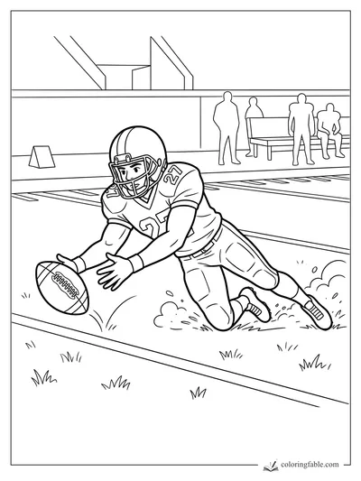 Football player 27 dives for a loose ball near the sideline as coaches watch from the bench.